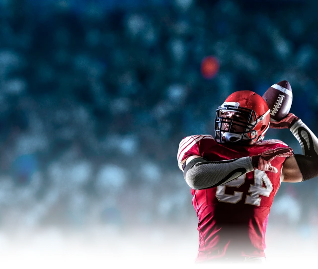 Football player catching ball